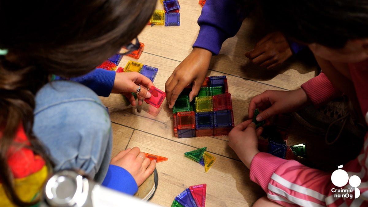 Branded stock image showing children playing a board game. 